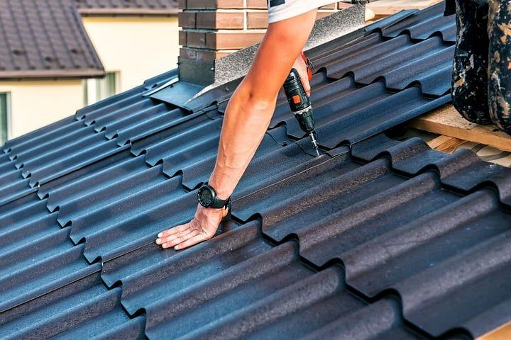 a man roofing a house