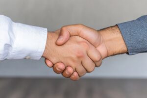 image showing handshake to imply partnership in real estate